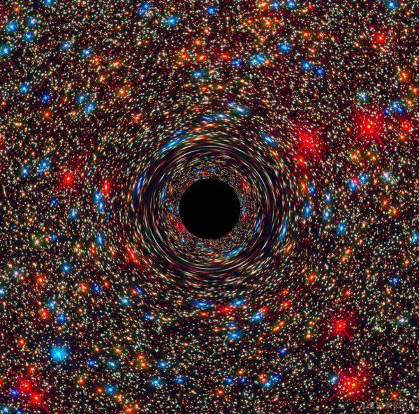 Вчені відкрили другу за величиною надмасивну чорну діру (фото). Чорна діра розташовується в невеликому кластері з 20 галактик.