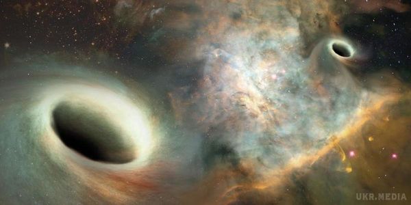 Вчені вперше виявили дві спарені чорні діри. Одна з чорних дір рухається по орбіті іншої.