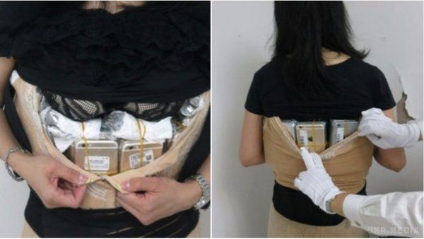 Як контрабандистка сховала під одягом 100 iPhone!. Дівчину з Китаю затримали через занадто 'дуту' верхню частину тіла.