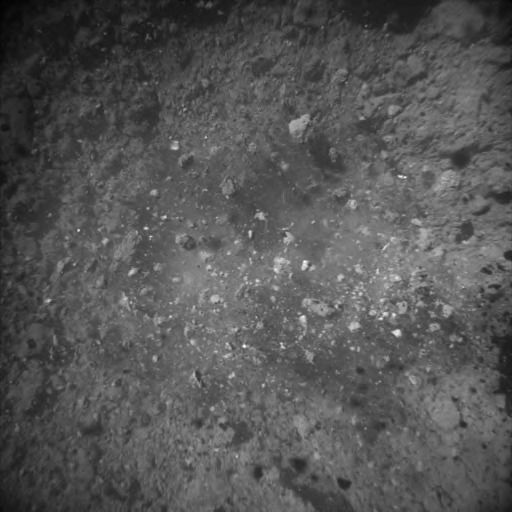 «Хаябуса-2» надіслала знімки забору ґрунту з Рюгу. На них видно уламки породи, які розлітаються після пострілу.